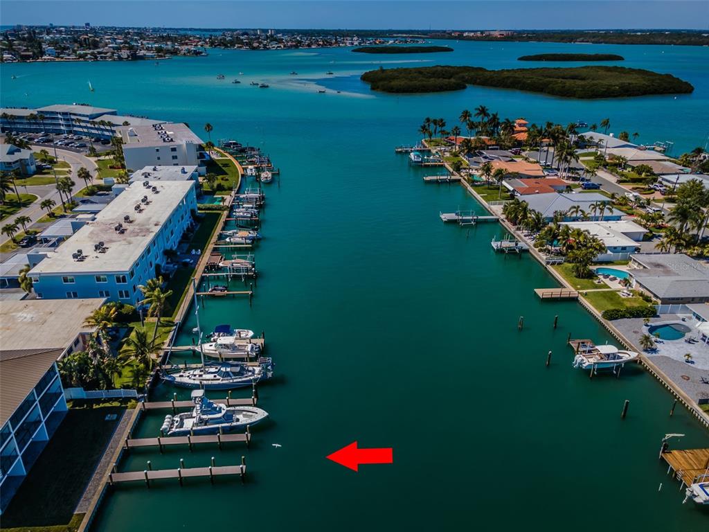 12305 3rd Street East, Unit 2 Treasure Island, FL 33706 - Photo 66 of 69 an aerial view of a house a yard pool table and chairs