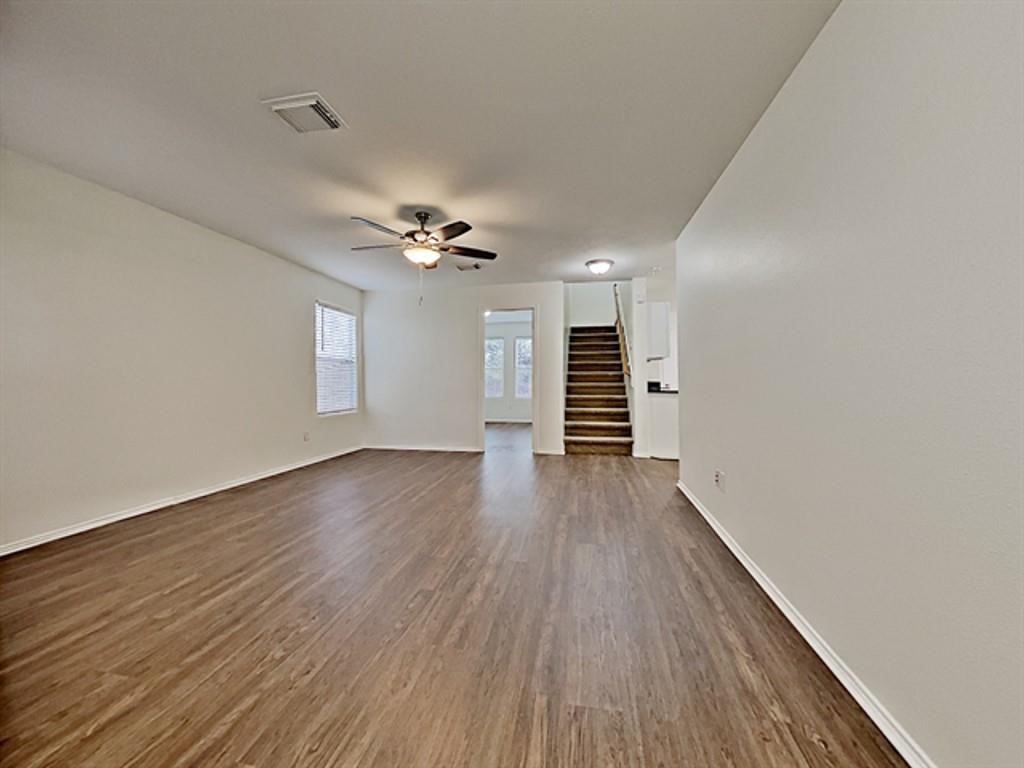 6830 Shallow River Court Spring, TX 77379 - Photo 7 of 17 wooden floor in an empty room with a window