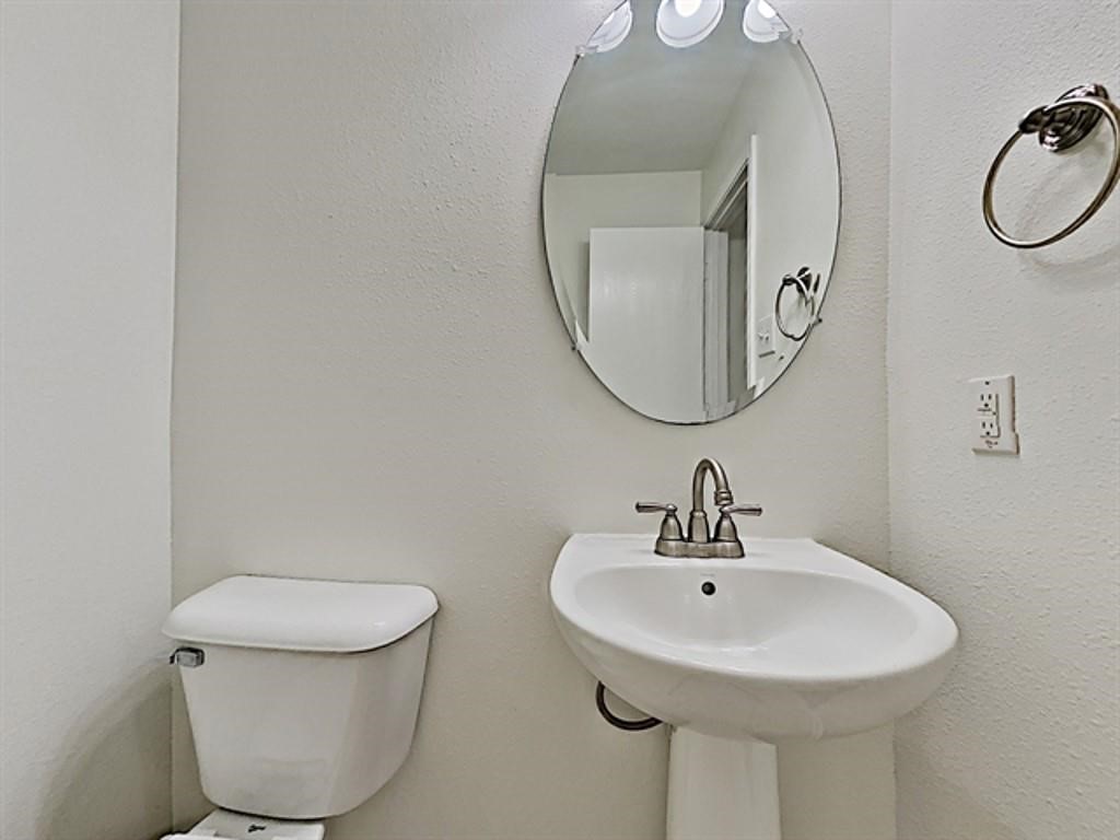 6830 Shallow River Court Spring, TX 77379 - Photo 8 of 17 a bathroom with a sink and a mirror