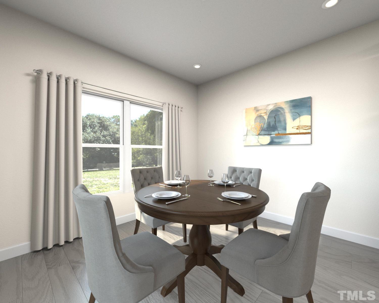 1071 Cherry Stem Road Haw River, NC 27258 - Photo 3 of 8 a view of a dining room with furniture window and wooden floor