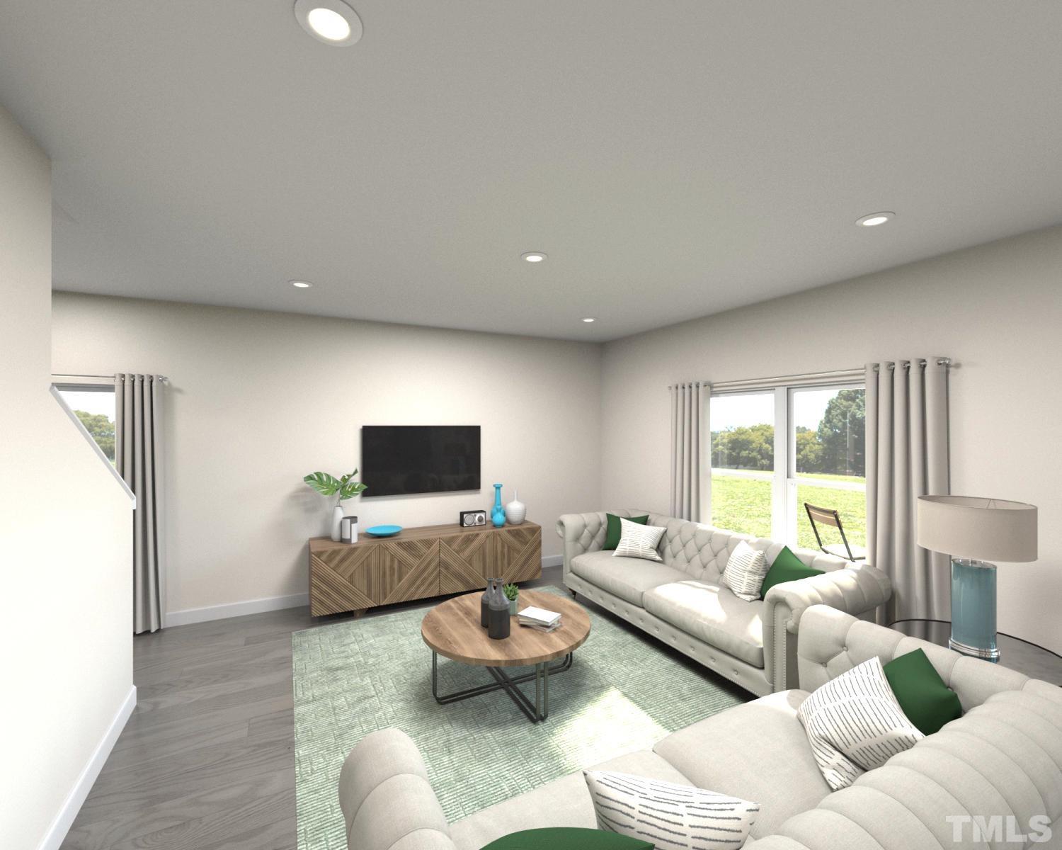 1071 Cherry Stem Road Haw River, NC 27258 - Photo 4 of 8 a living room with furniture and a flat screen tv