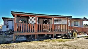 Rear view of house featuring a deck