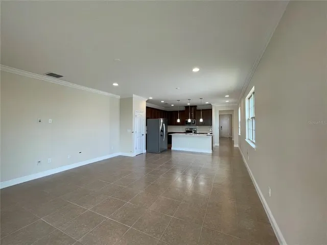 a view of kitchen with furniture and window