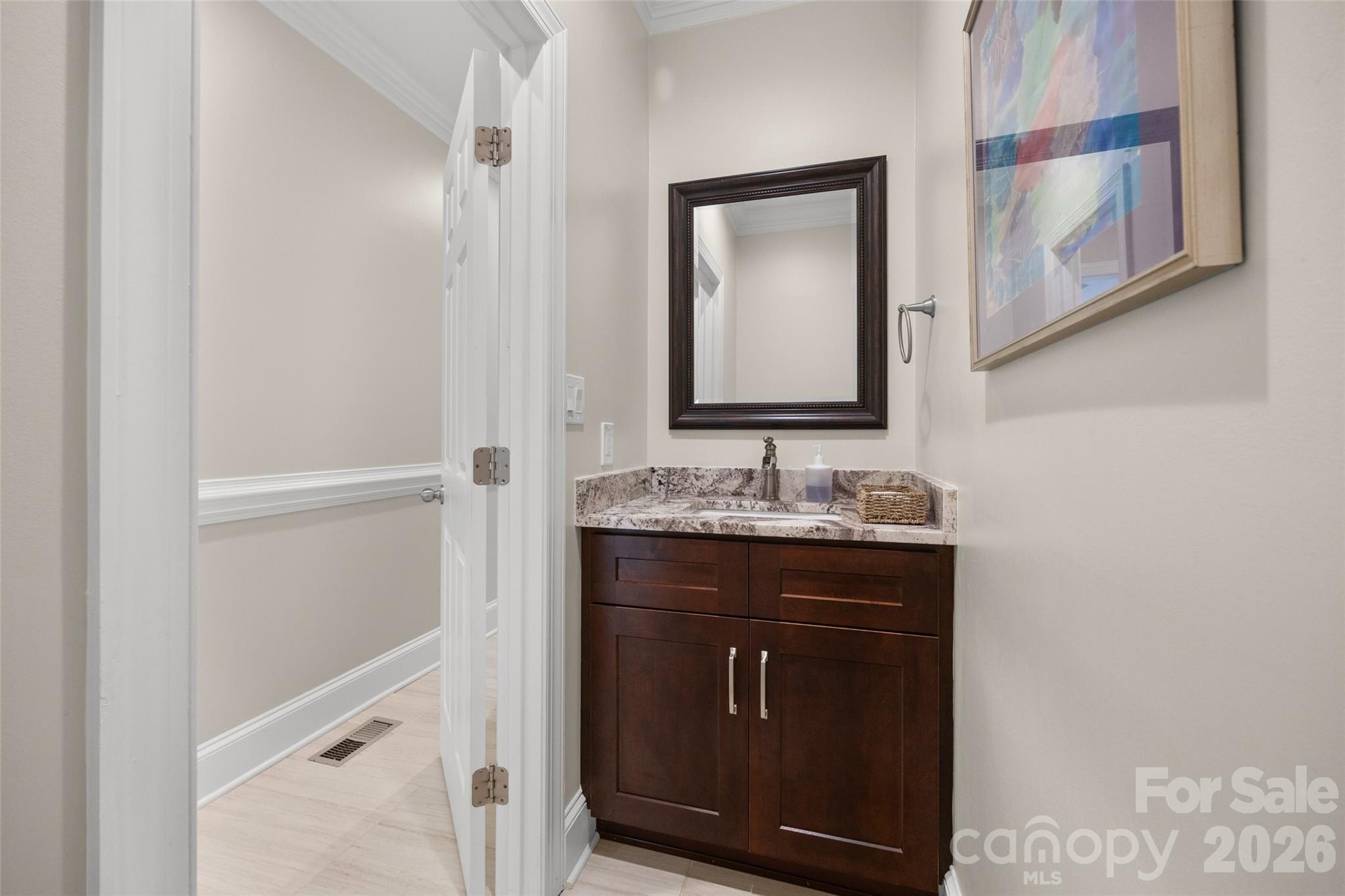 636 Landsdowne Court Fort Mill, SC 29708 - Photo 16 of 48 a bathroom with a sink and a mirror