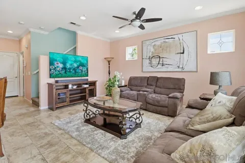 a living room with furniture and a flat screen tv