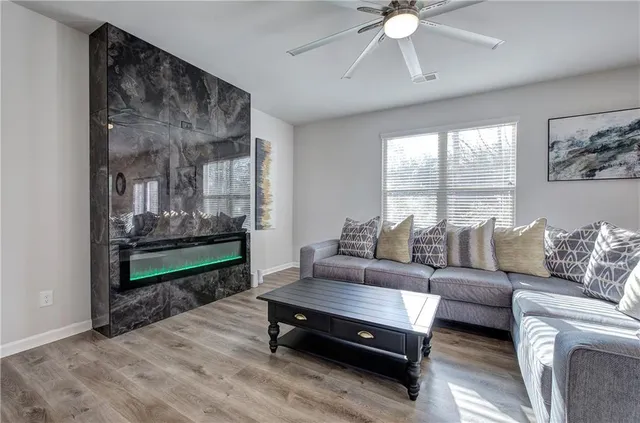 a room with a wooden floor and furniture