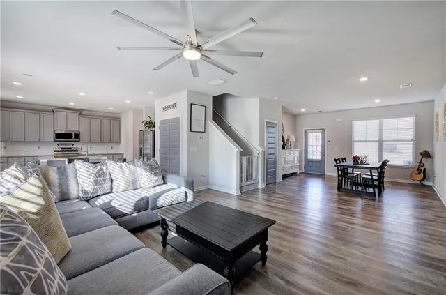 a view of dining room with furniture and wooden floor