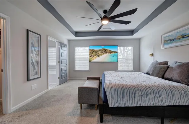 a spacious bathroom with a granite countertop tub sink and mirror