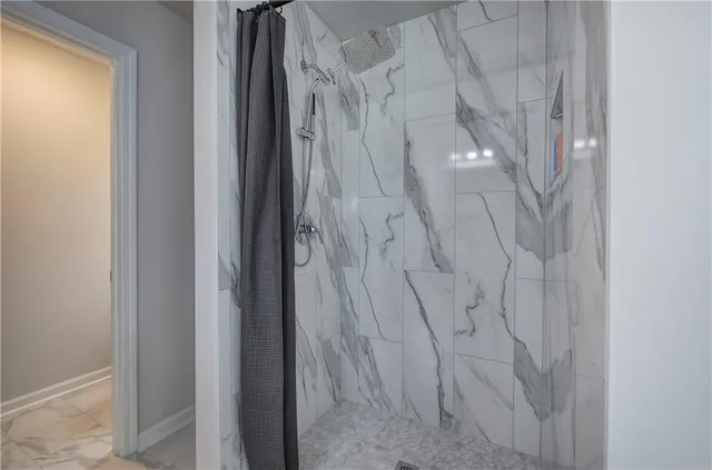 a utility room with a sink and a mirror
