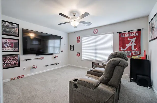 a view of a bedroom with a bed and a window