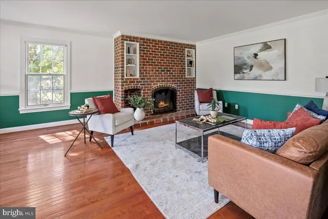 a large kitchen with stainless steel appliances granite countertop a stove and a refrigerator