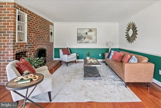 a kitchen with granite countertop white cabinets and stainless steel appliances