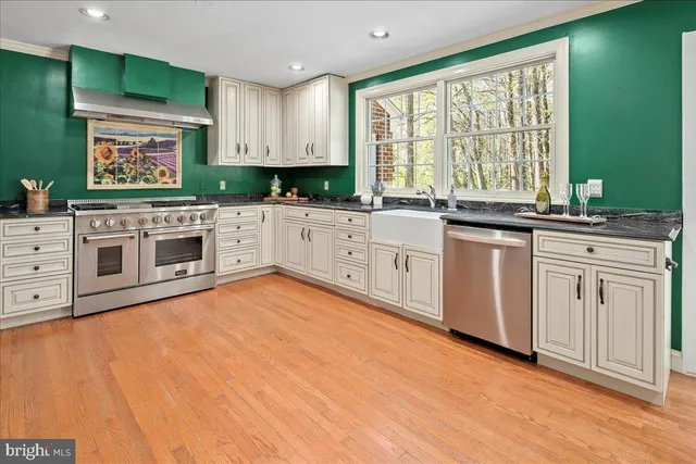 a spacious bedroom with a balcony a bed and a fireplace