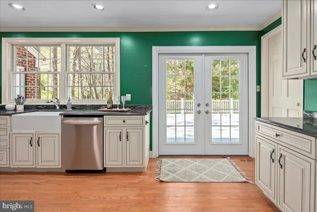 a bathroom with a bathtub toilet and window