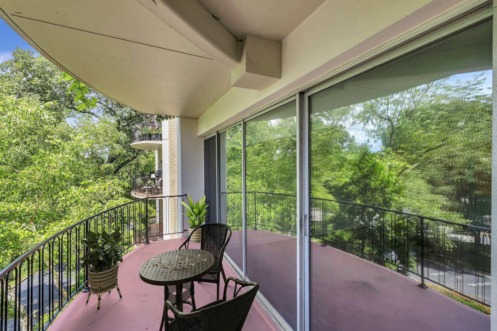 4215 Harding Pike, Unit 403 Nashville, TN 37205 - Photo 20 of 25 a view of a porch with furniture and a yard