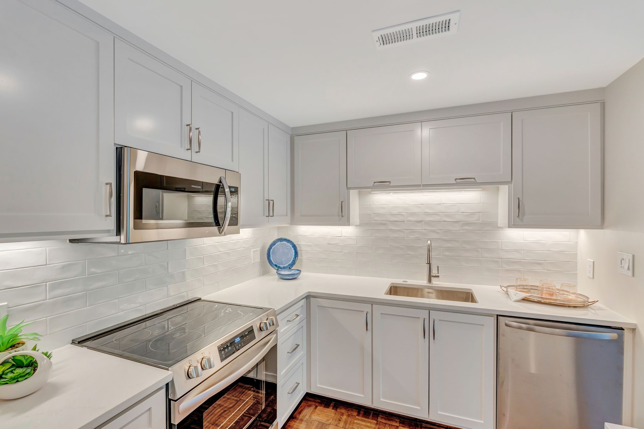 4215 Harding Pike, Unit 403 Nashville, TN 37205 - Photo 2 of 25 a kitchen with a sink cabinets and stainless steel appliances