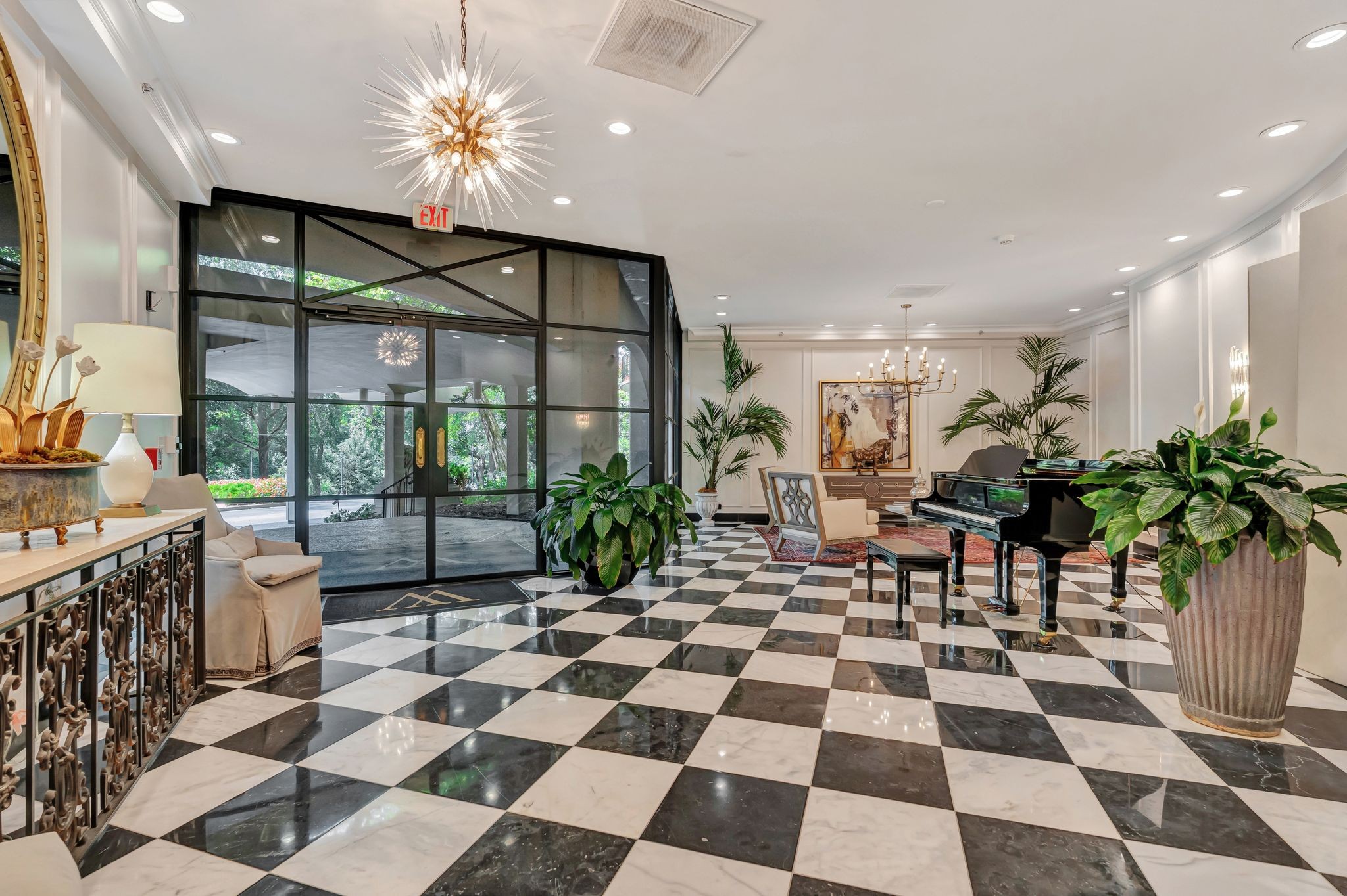 4215 Harding Pike, Unit 403 Nashville, TN 37205 - Photo 21 of 25 a living room with a black white checkered floor with couches chair and a coffee table