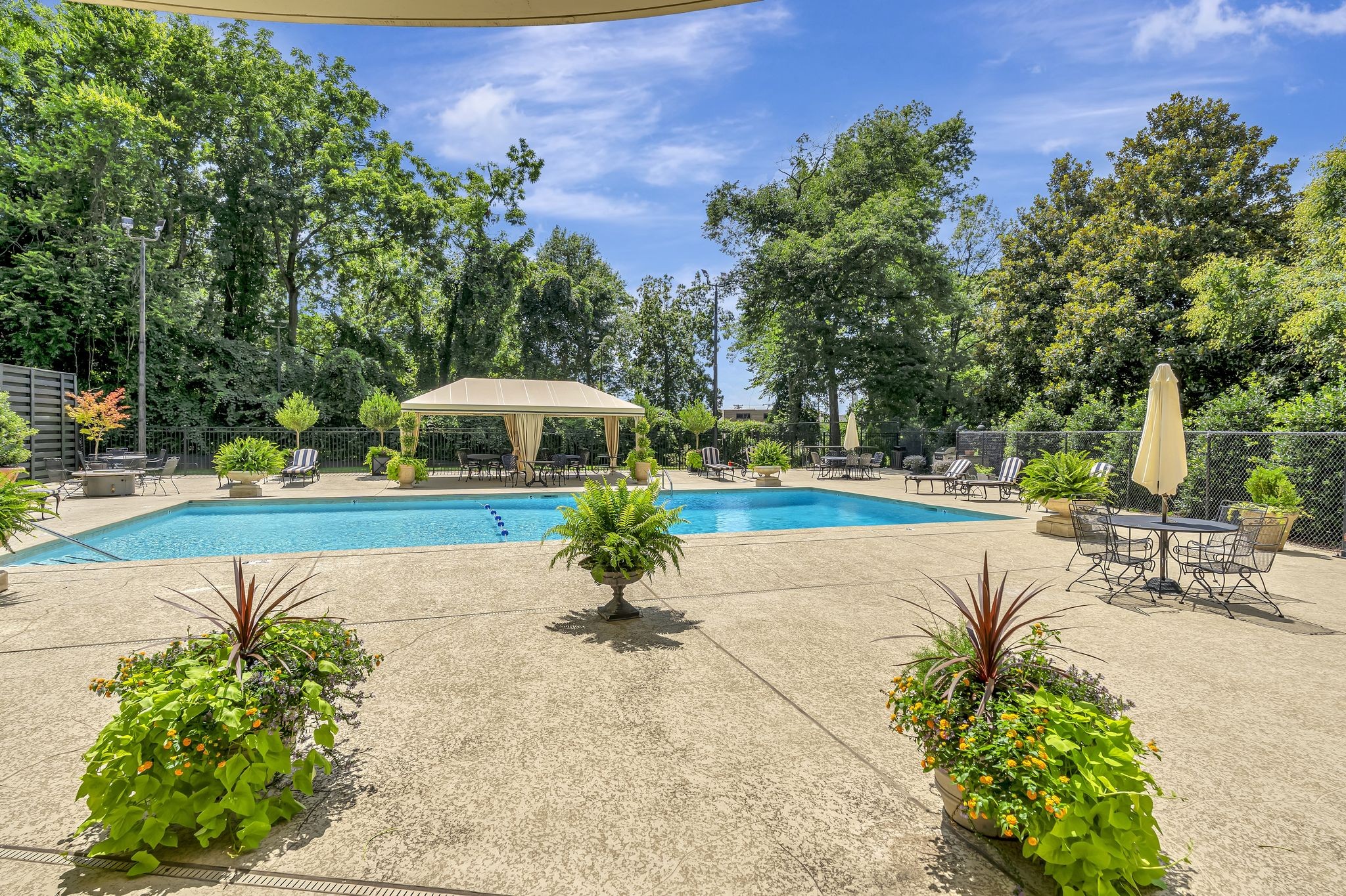 4215 Harding Pike, Unit 403 Nashville, TN 37205 - Photo 22 of 25 a view of a swimming pool with a patio