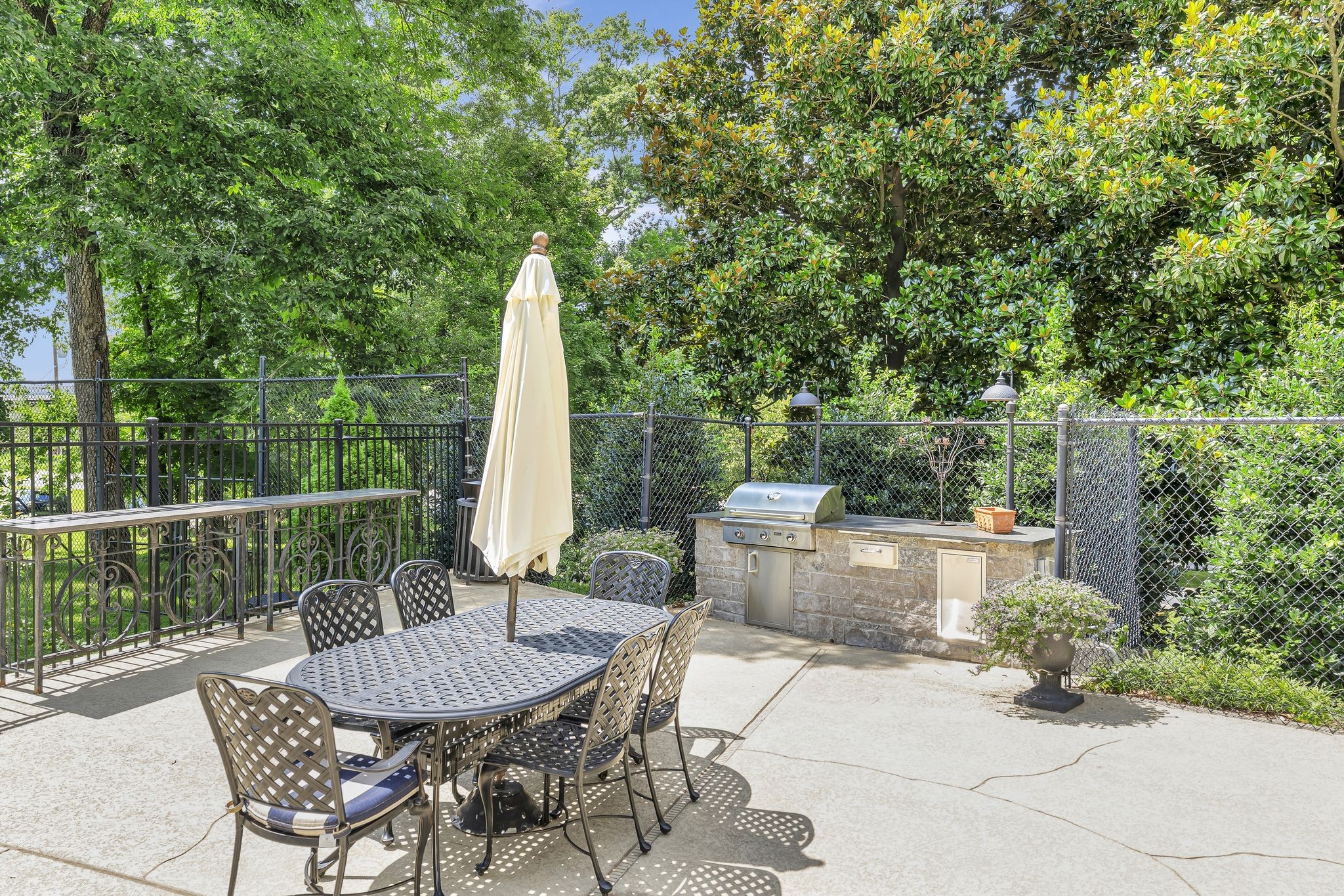4215 Harding Pike, Unit 403 Nashville, TN 37205 - Photo 24 of 25 a view of a patio with a table and chairs