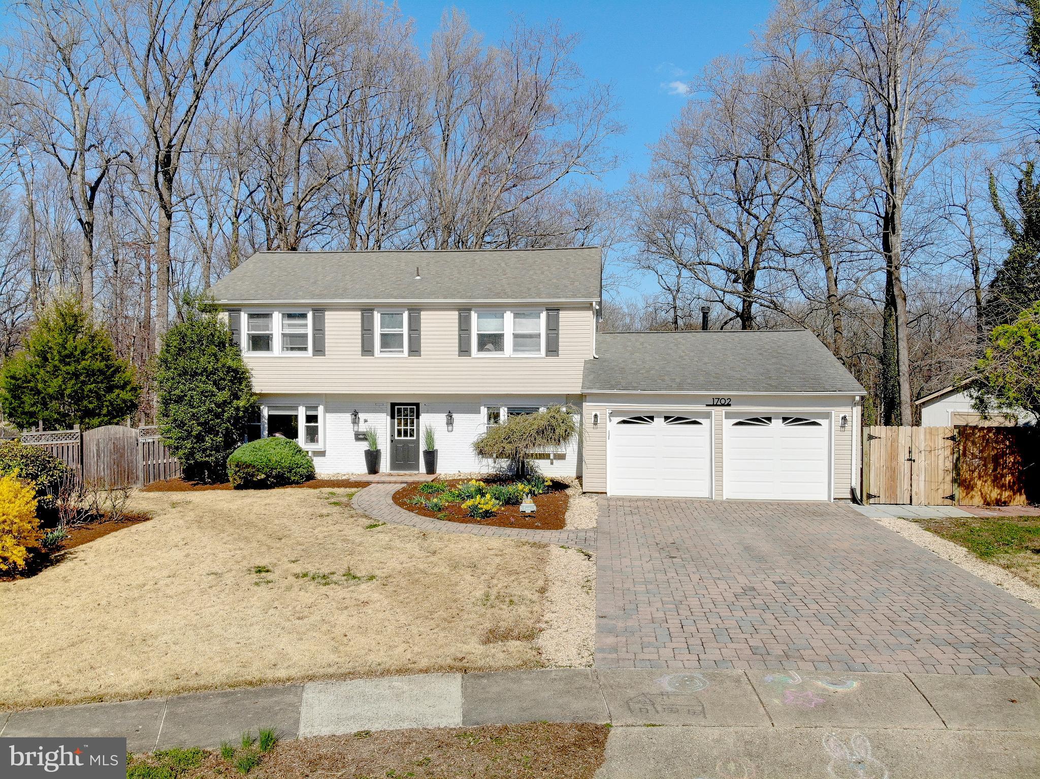 1702 Saxony Place Crofton, MD 21114 - Photo 1 of 65 front view of a house with a yard