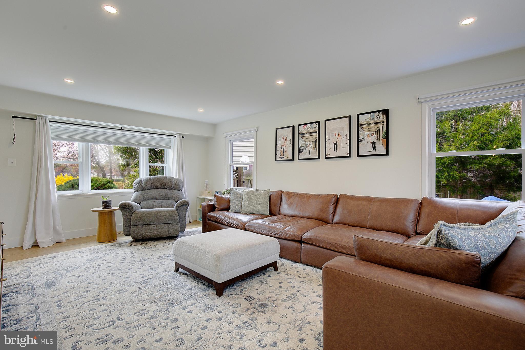 1702 Saxony Place Crofton, MD 21114 - Photo 15 of 65 a living room with furniture and a large window