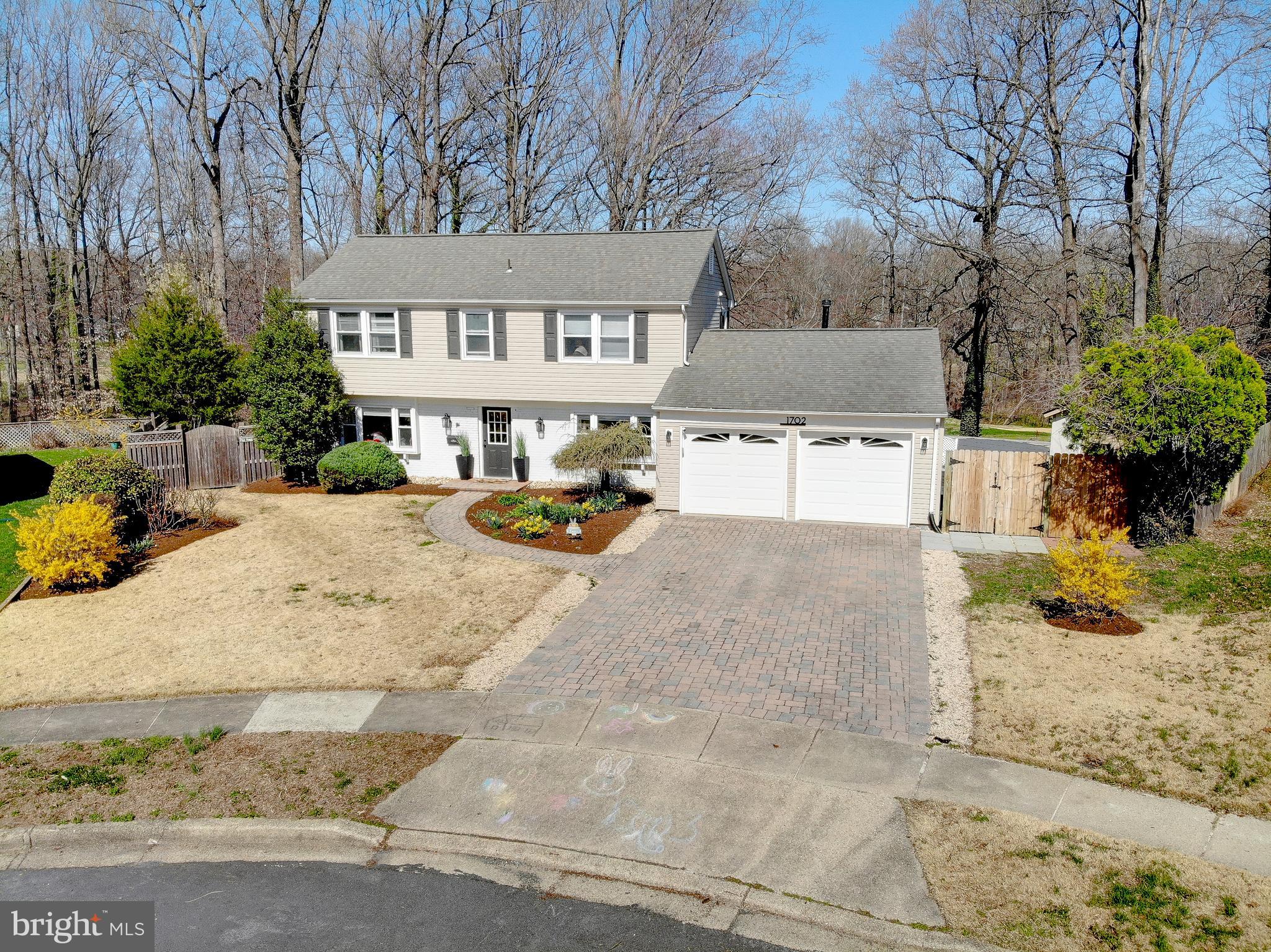 1702 Saxony Place Crofton, MD 21114 - Photo 2 of 65 a view of a house with snow on the side of the road