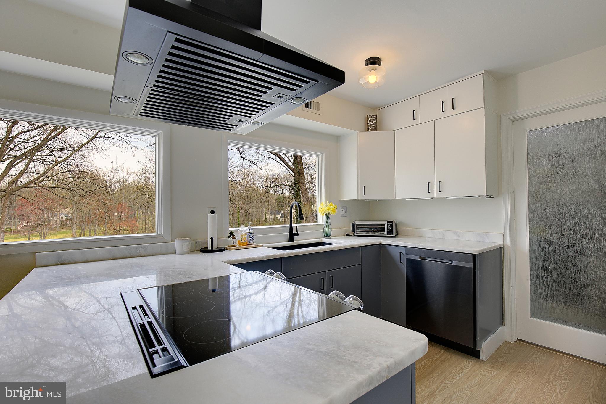 1702 Saxony Place Crofton, MD 21114 - Photo 25 of 65 a kitchen with a stove a sink and a refrigerator