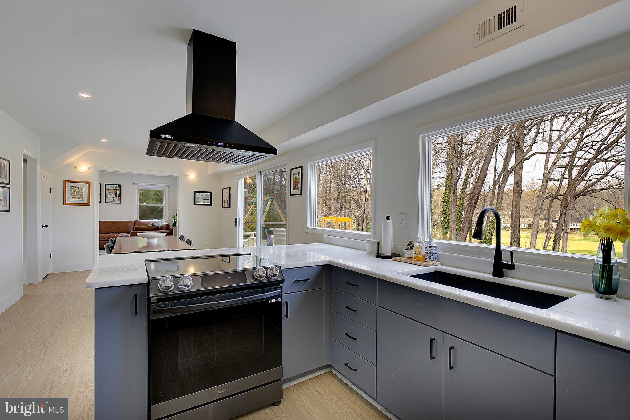 1702 Saxony Place Crofton, MD 21114 - Photo 26 of 65 a kitchen with stainless steel appliances a sink and a stove