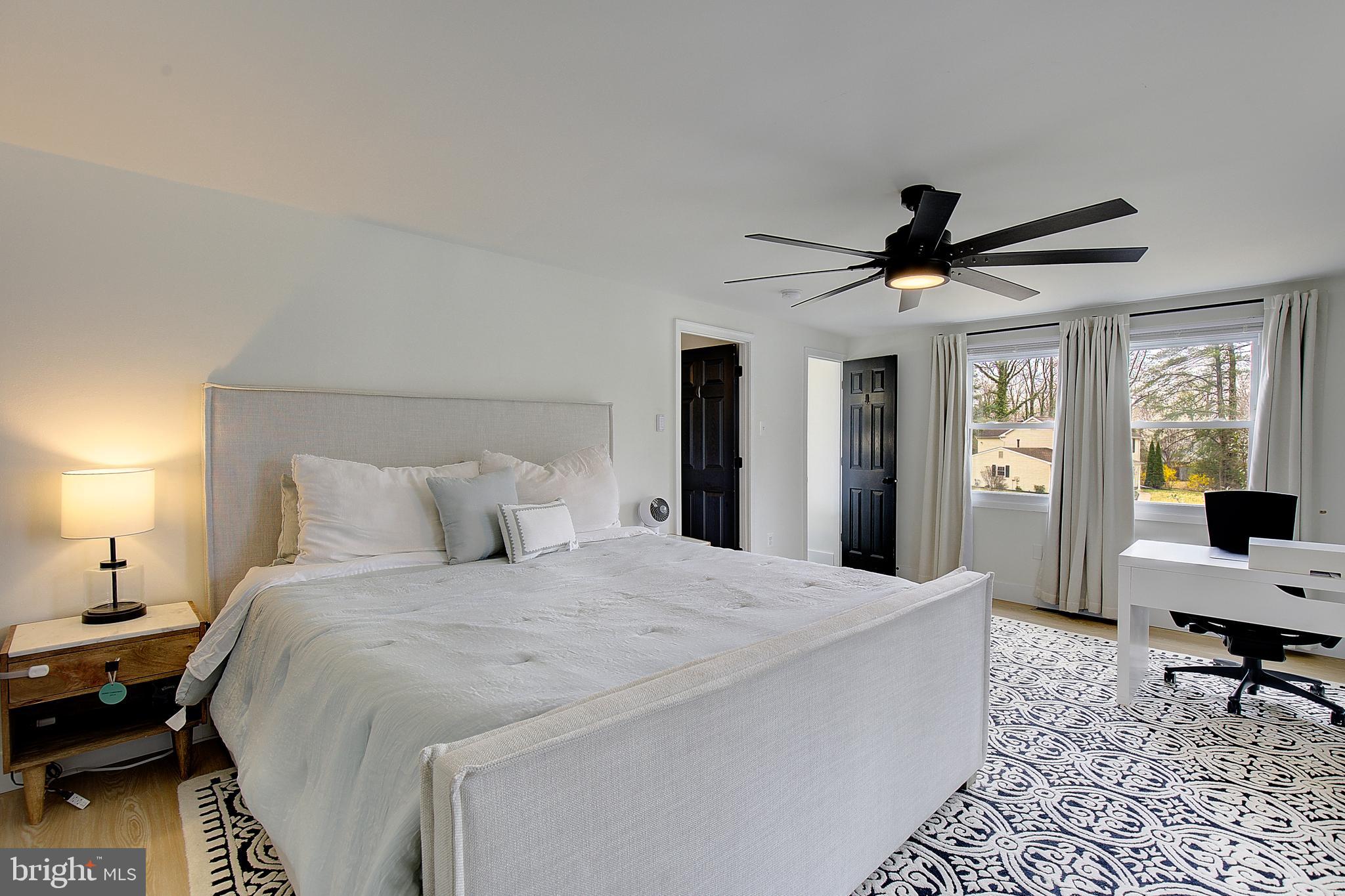1702 Saxony Place Crofton, MD 21114 - Photo 39 of 65 a bed room with a bed and a chandelier