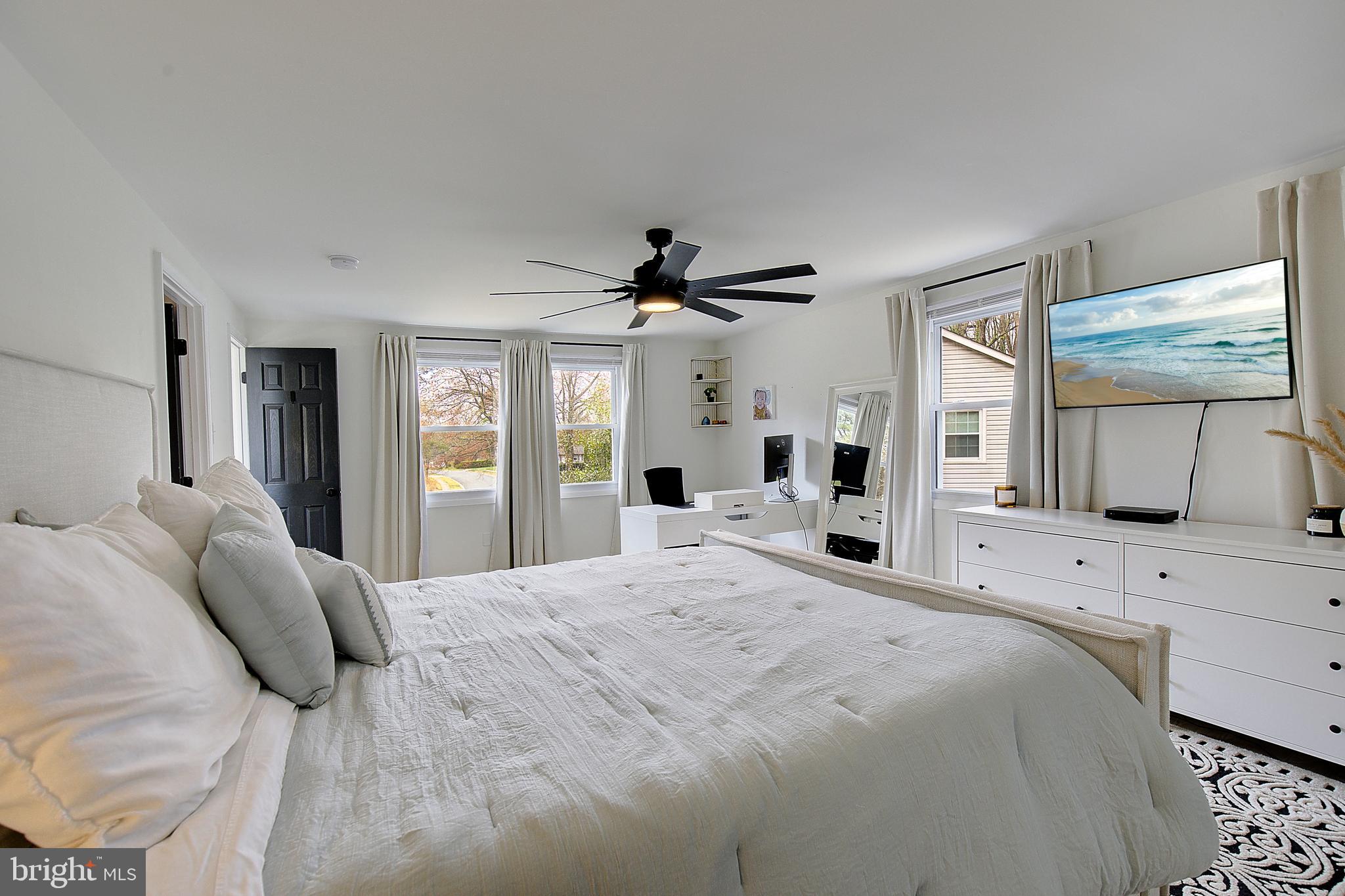 1702 Saxony Place Crofton, MD 21114 - Photo 40 of 65 a bedroom with a large bed and a window