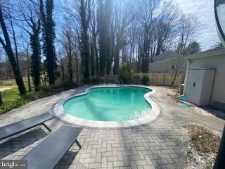 1702 Saxony Place Crofton, MD 21114 - Photo 46 of 65 a view of a swimming pool with a patio