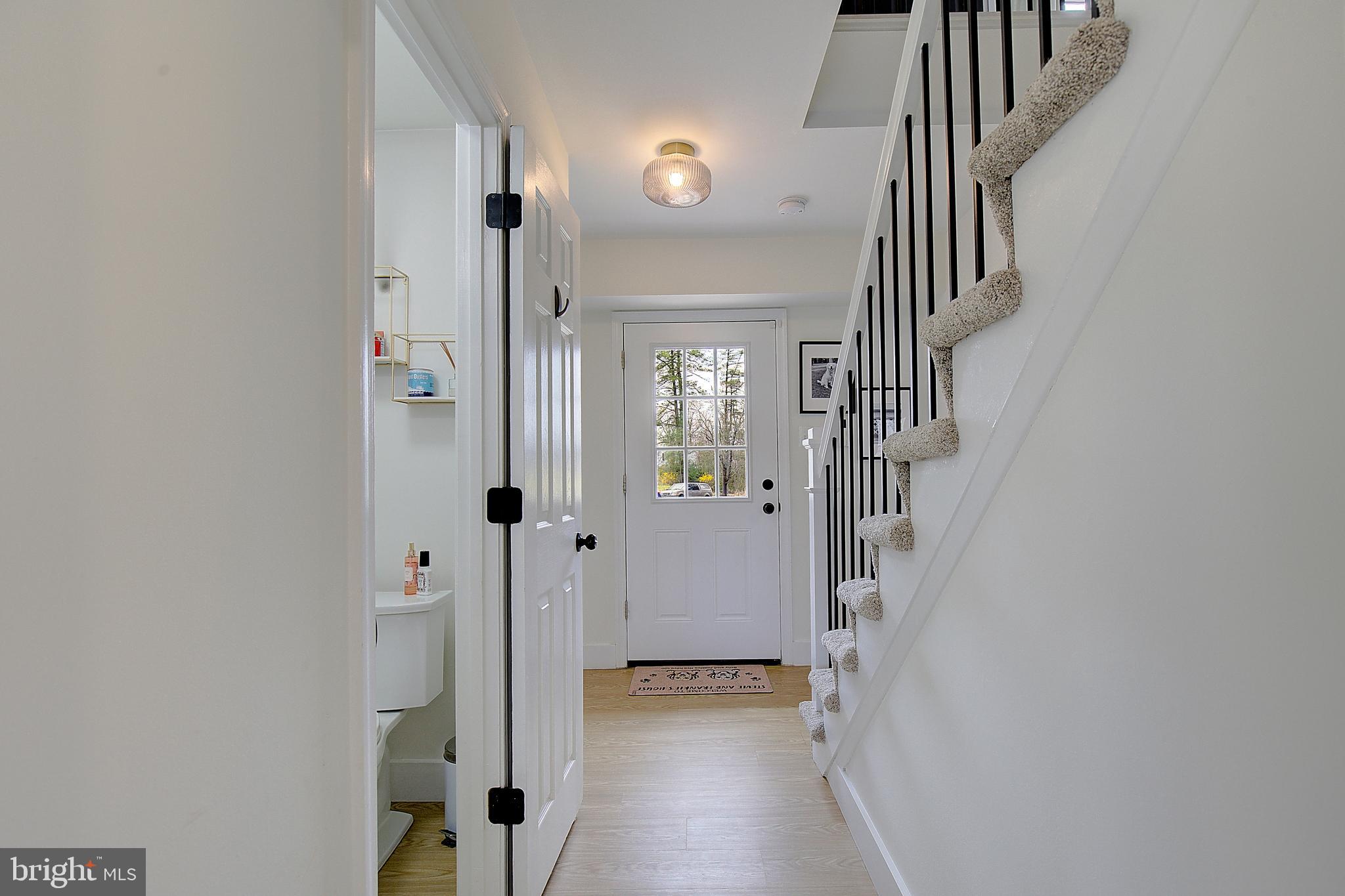 1702 Saxony Place Crofton, MD 21114 - Photo 6 of 65 a view of hallway with stairs