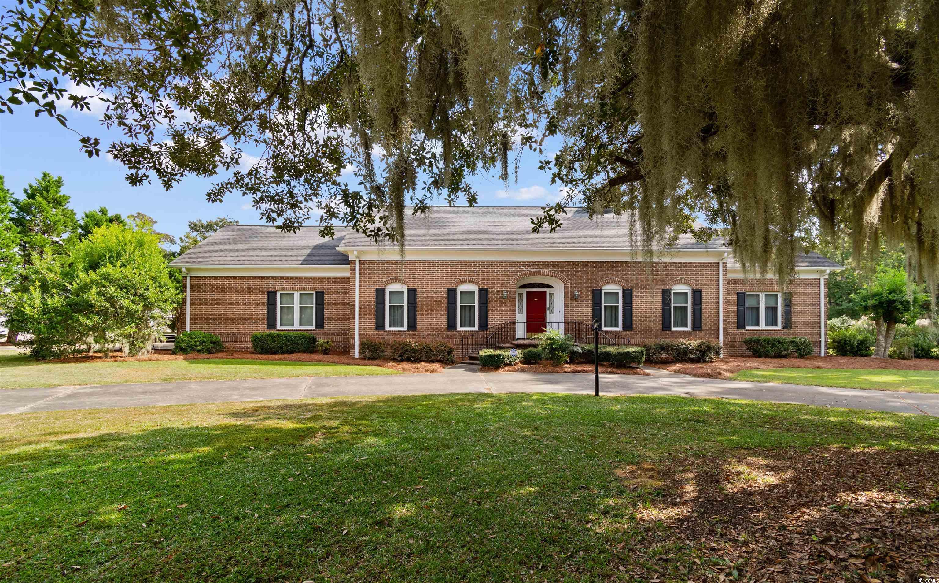 14 Live Oak Lane Georgetown, SC 29440 - Photo 1 of 40 View of front of property featuring a front lawn, brick siding, and roof with shingles
