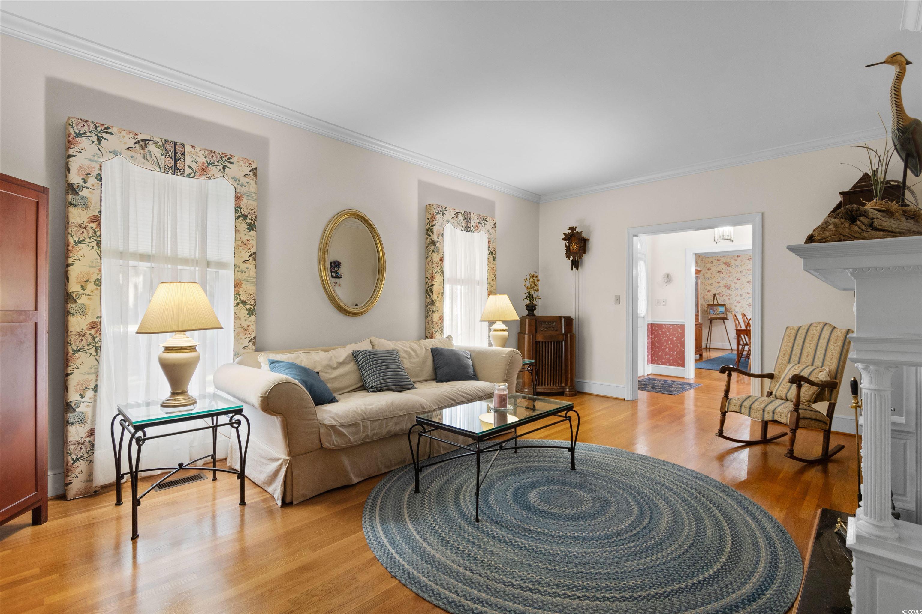 14 Live Oak Lane Georgetown, SC 29440 - Photo 13 of 40 Living area with ornamental molding and original hardwood floors.