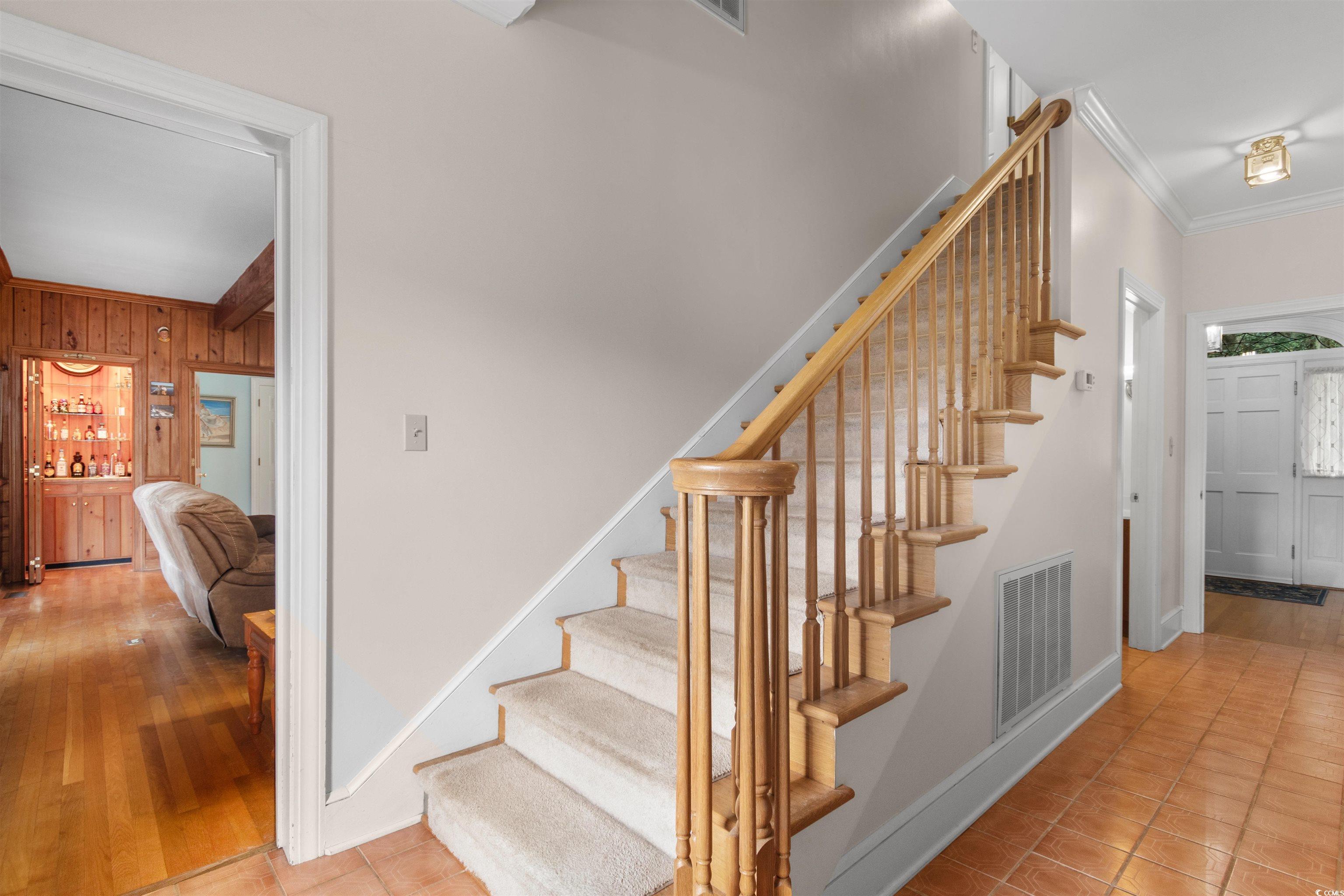 14 Live Oak Lane Georgetown, SC 29440 - Photo 15 of 40 Stairway with ornamental molding, and tile patterned floors