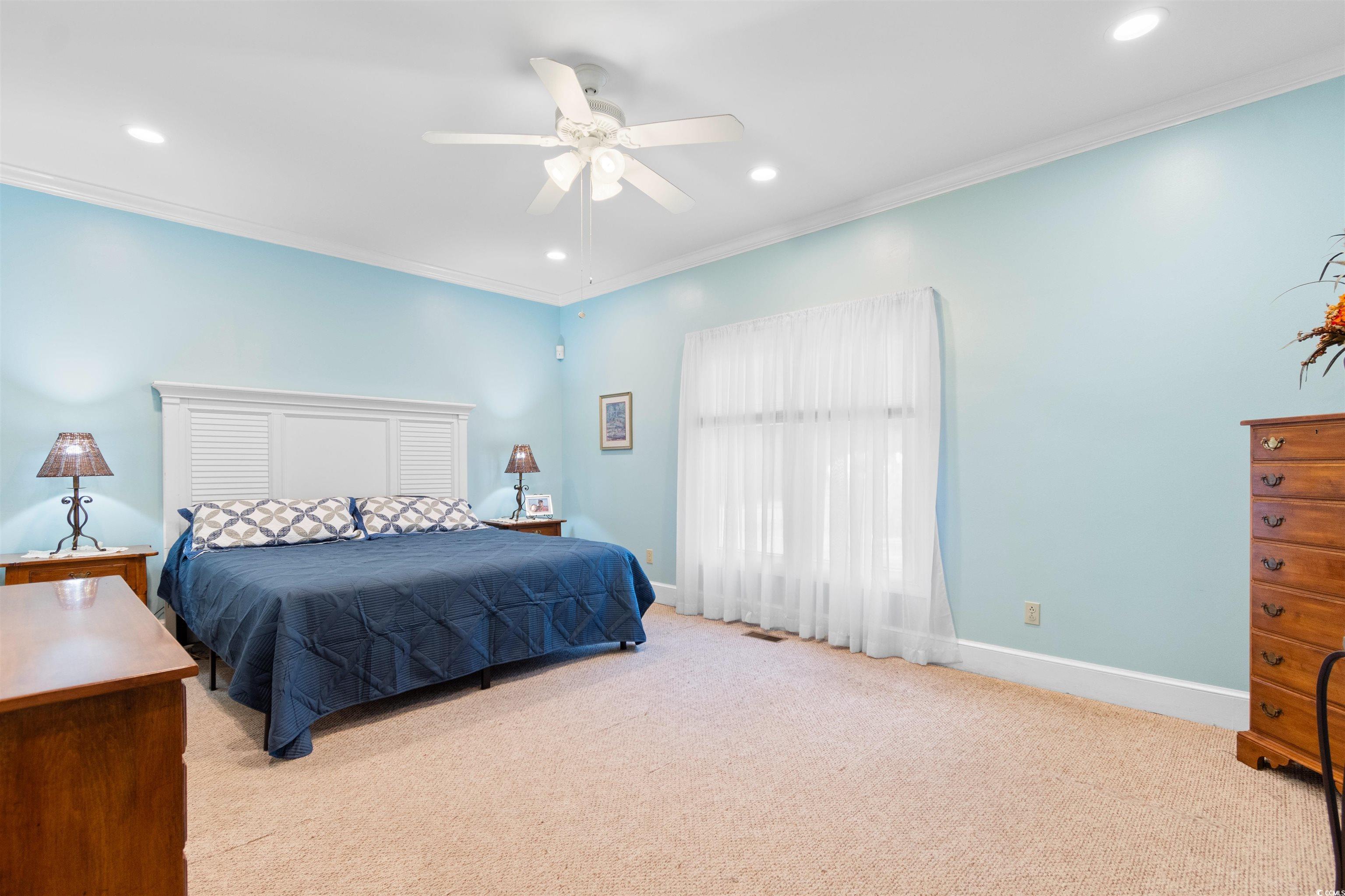 14 Live Oak Lane Georgetown, SC 29440 - Photo 18 of 40 Bedroom with crown molding, light colored carpet, recessed lighting, and ceiling fan