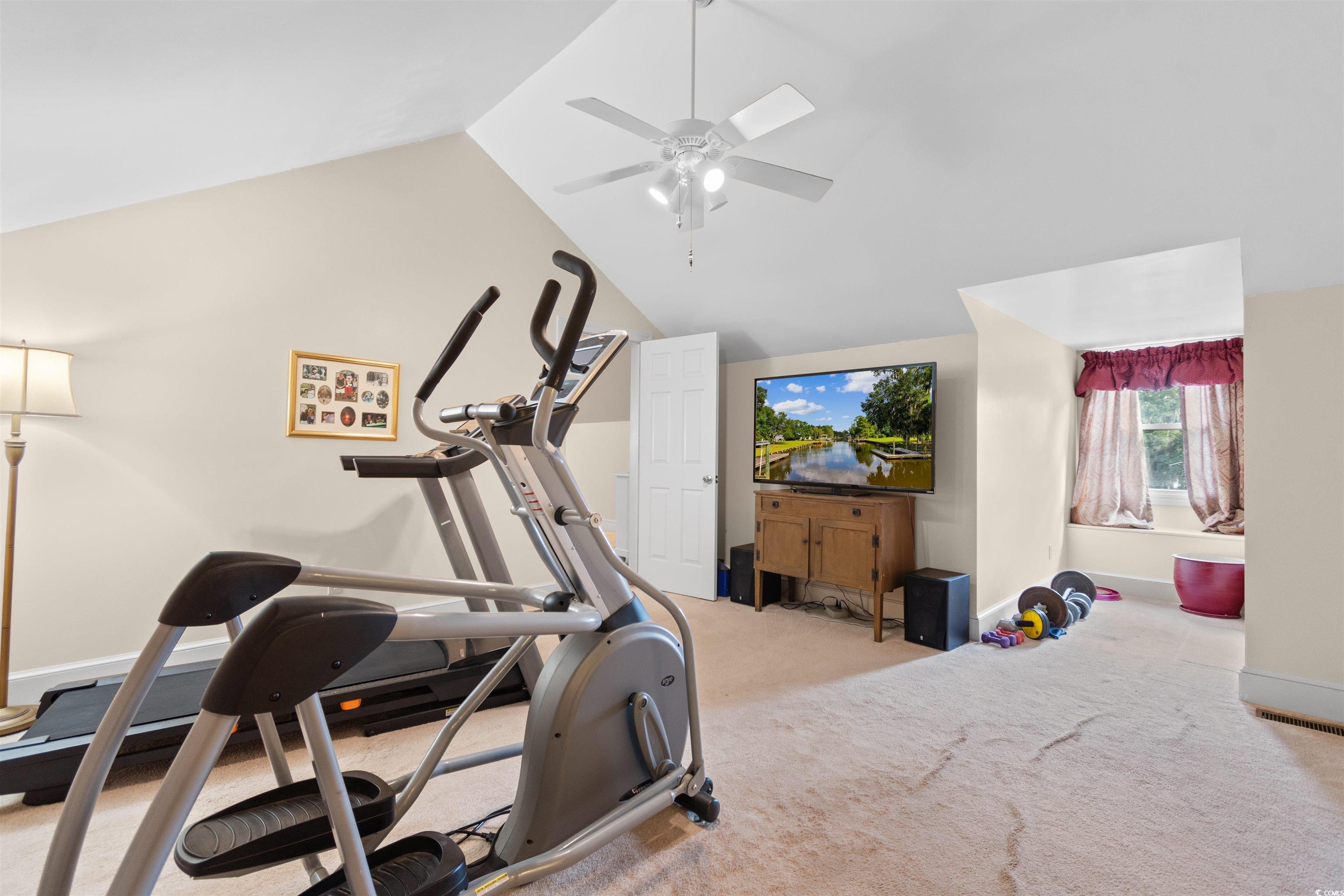 14 Live Oak Lane Georgetown, SC 29440 - Photo 21 of 40 Exercise area with light colored carpet, lofted ceiling, and ceiling fan