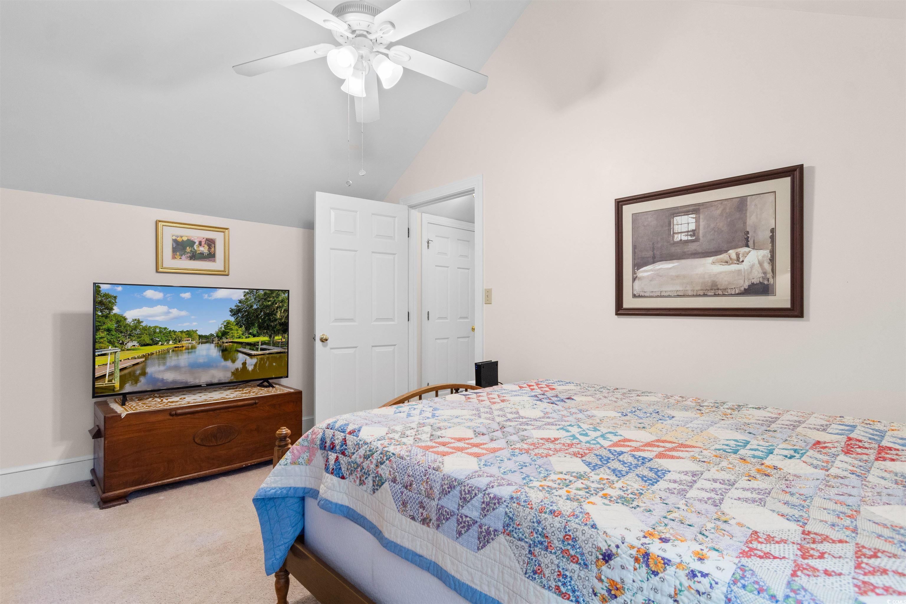 14 Live Oak Lane Georgetown, SC 29440 - Photo 25 of 40 Bedroom featuring light carpet, ceiling fan, and high vaulted ceiling