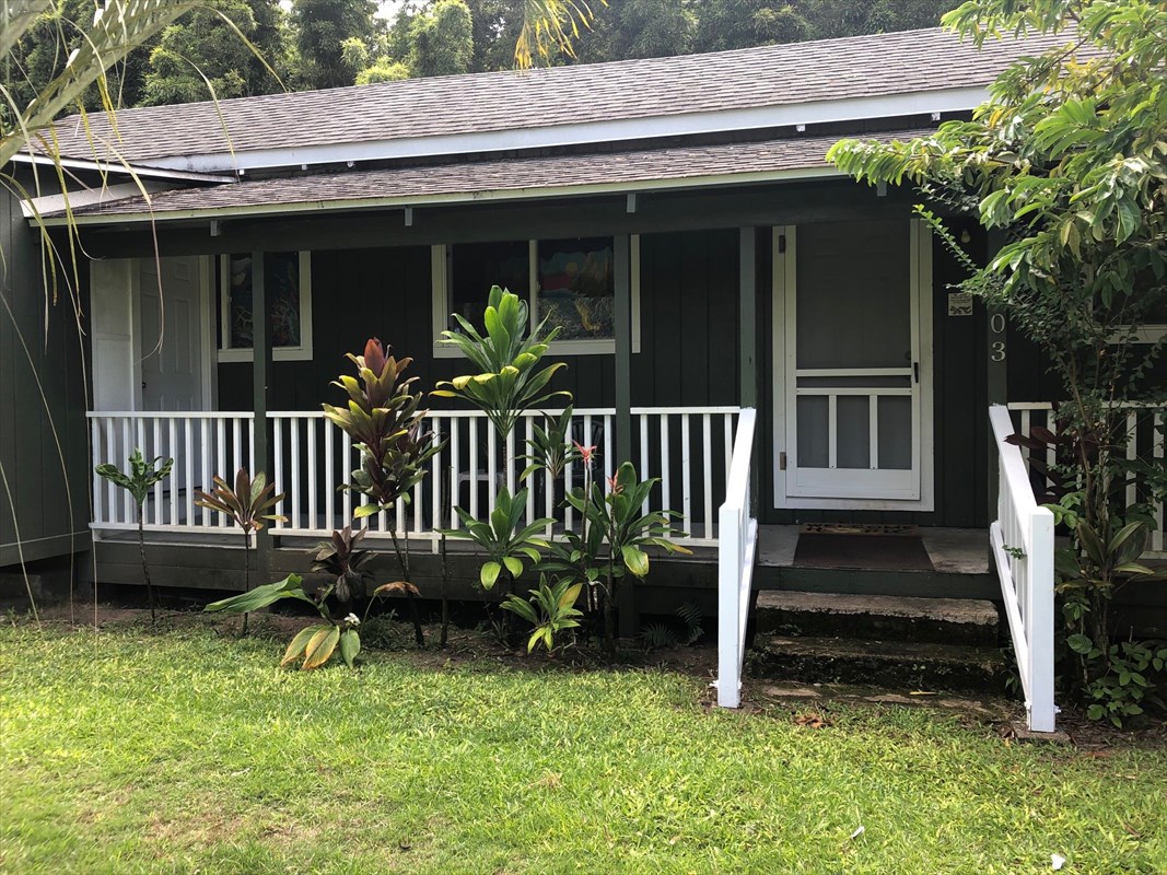 5203 Weke Road Hanalei, HI 96714 - Photo 3 of 16 a view of a chair and table in backyard of the house