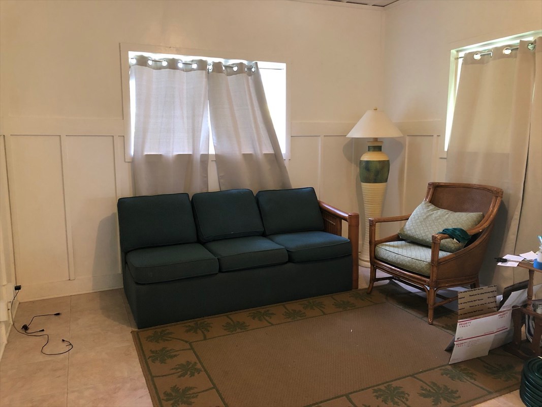 5203 Weke Road Hanalei, HI 96714 - Photo 8 of 16 a living room with furniture and a window