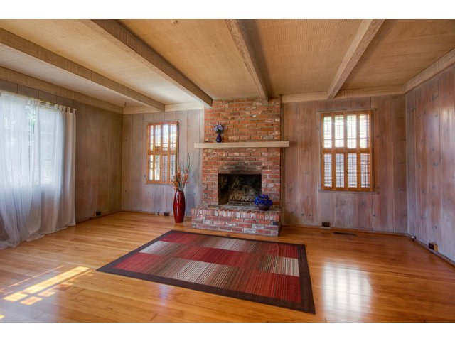 0 Carpenter Street Carmel, CA 93923 - Photo 3 of 20 a living room with a fireplace furniture and a window