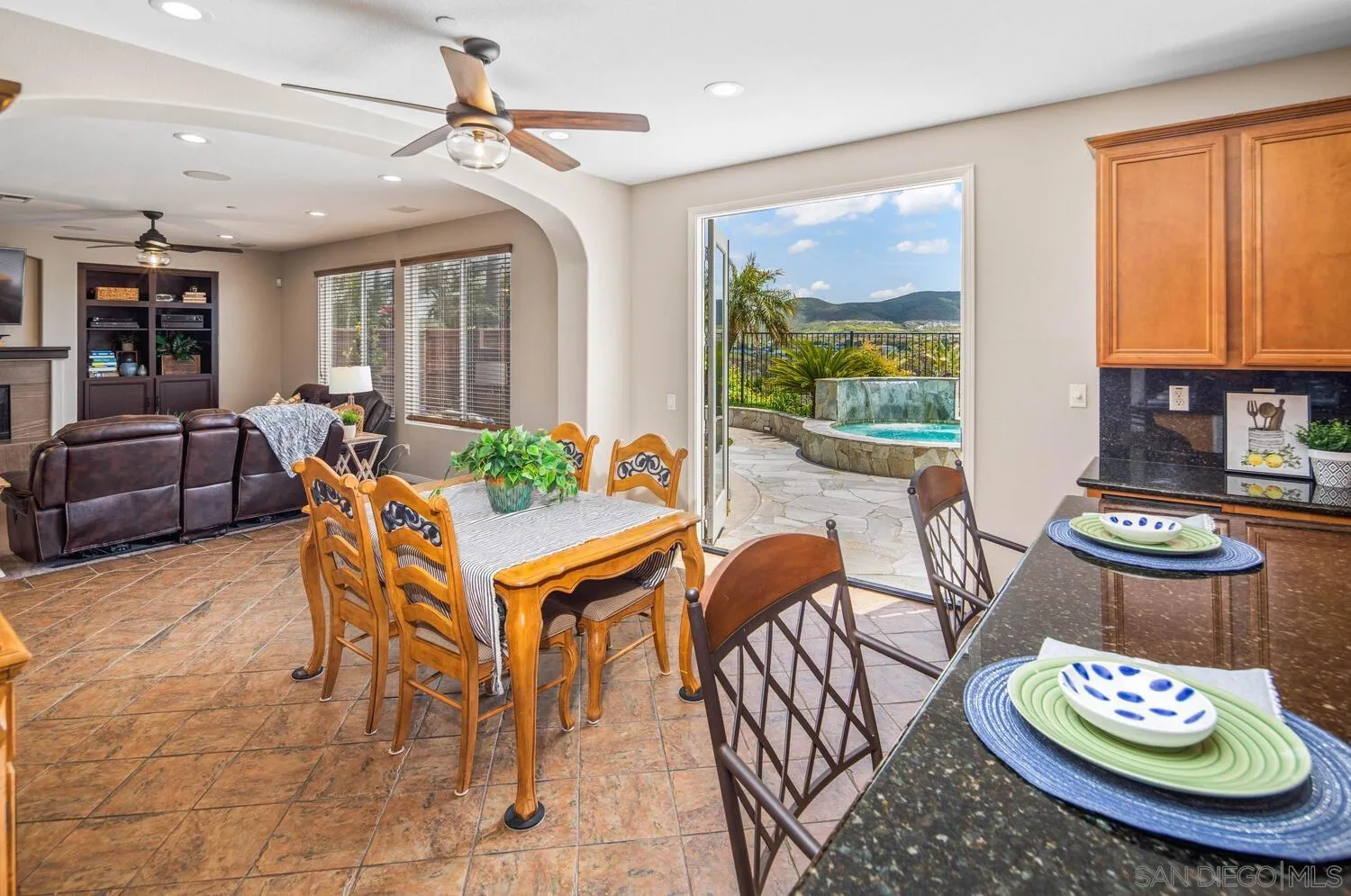 16327 Pinto Ridge Drive 4S Ranch, CA 92127 - Photo 22 of 74 a dining room with furniture a rug and wooden floor