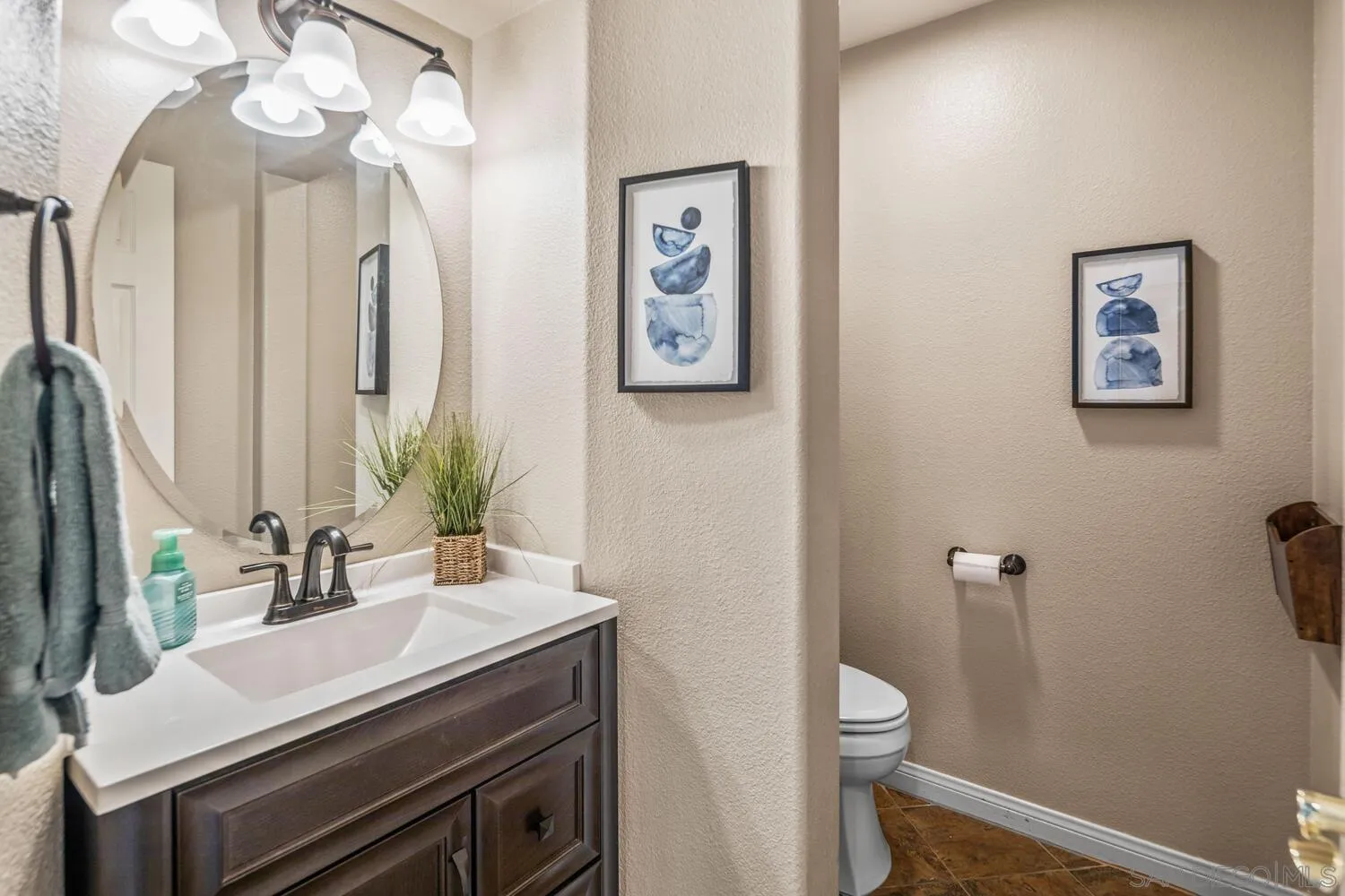 16327 Pinto Ridge Drive 4S Ranch, CA 92127 - Photo 32 of 74 a bathroom with a sink vanity and a toilet