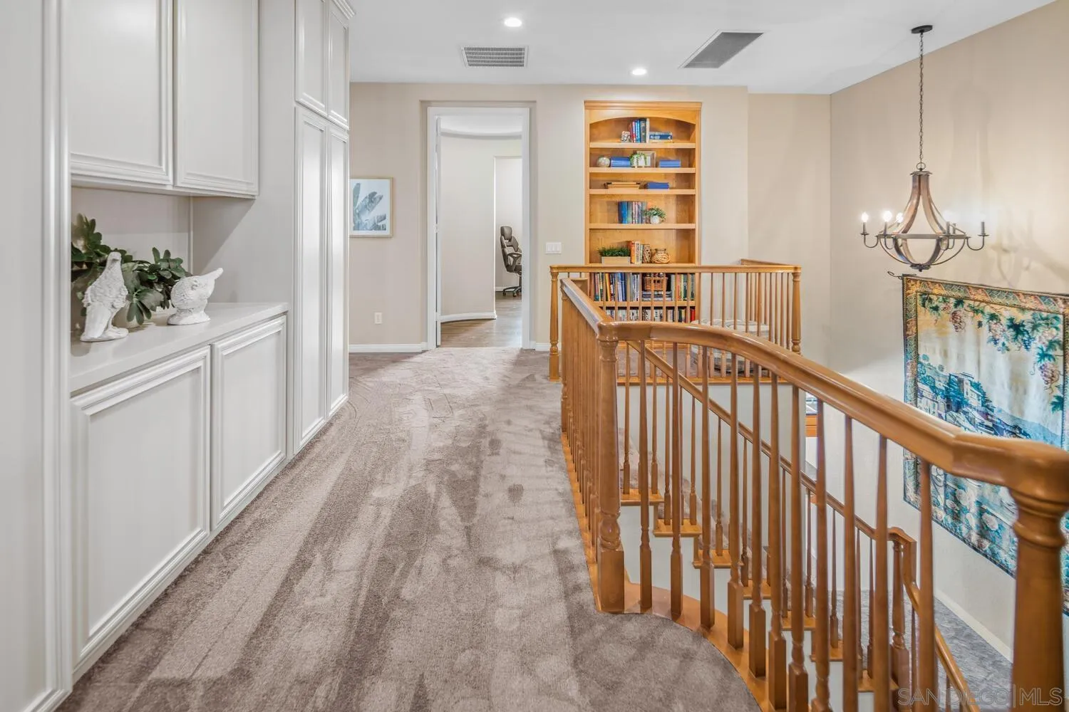 16327 Pinto Ridge Drive 4S Ranch, CA 92127 - Photo 34 of 74 a view of a hallway with wooden floor and entryway