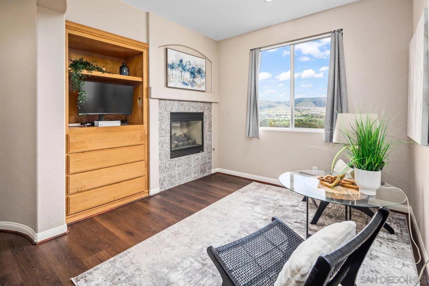 16327 Pinto Ridge Drive 4S Ranch, CA 92127 - Photo 37 of 74 a living room with furniture and a flat screen tv
