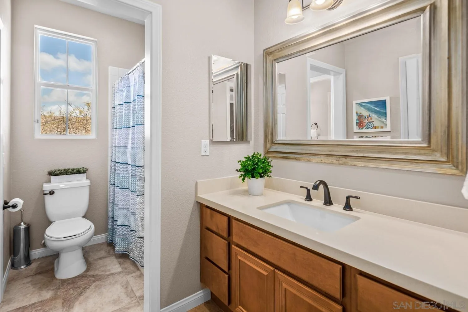 16327 Pinto Ridge Drive 4S Ranch, CA 92127 - Photo 47 of 74 a bathroom with a sink a toilet and shower