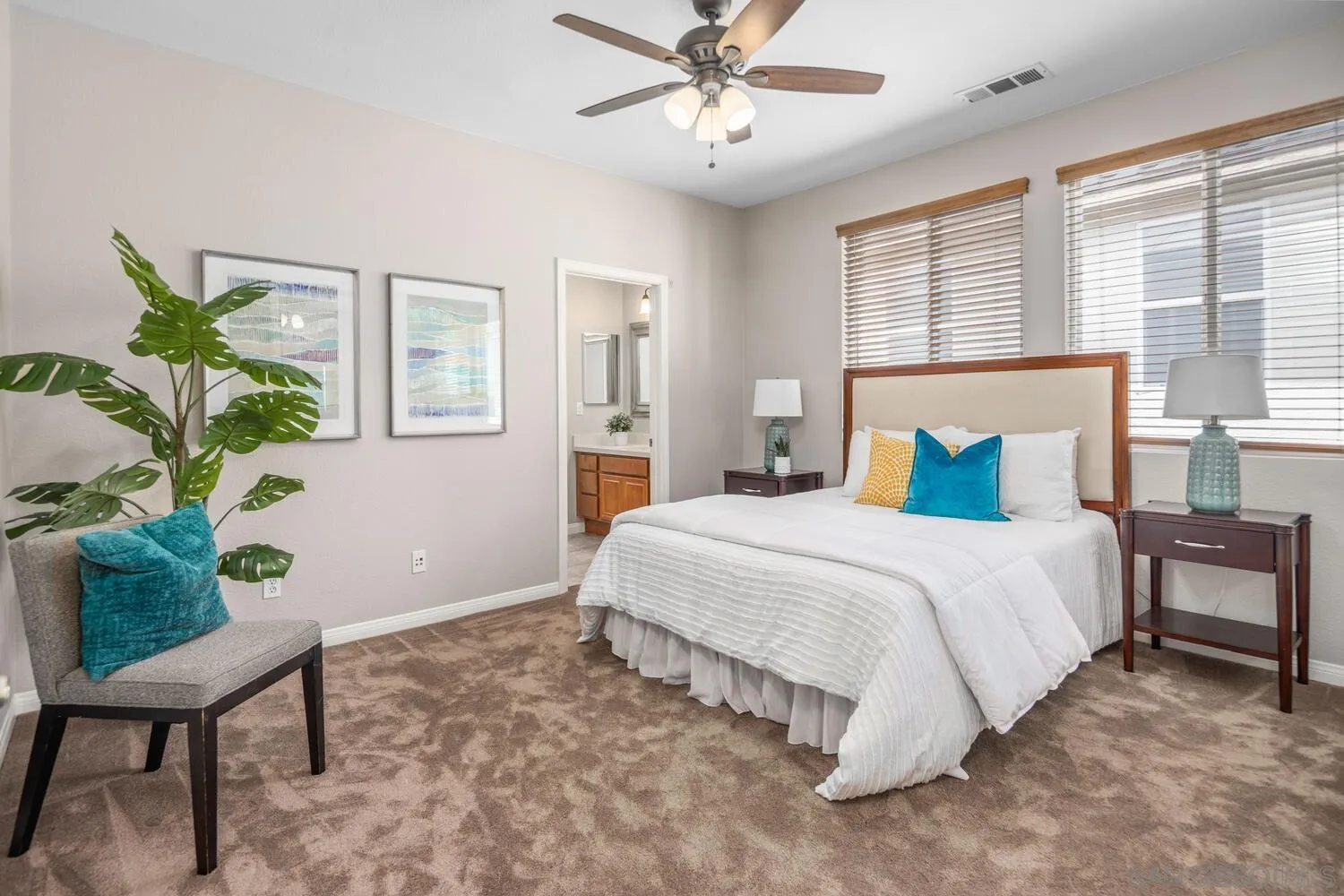 16327 Pinto Ridge Drive 4S Ranch, CA 92127 - Photo 49 of 74 a bedroom with a bed table and chair