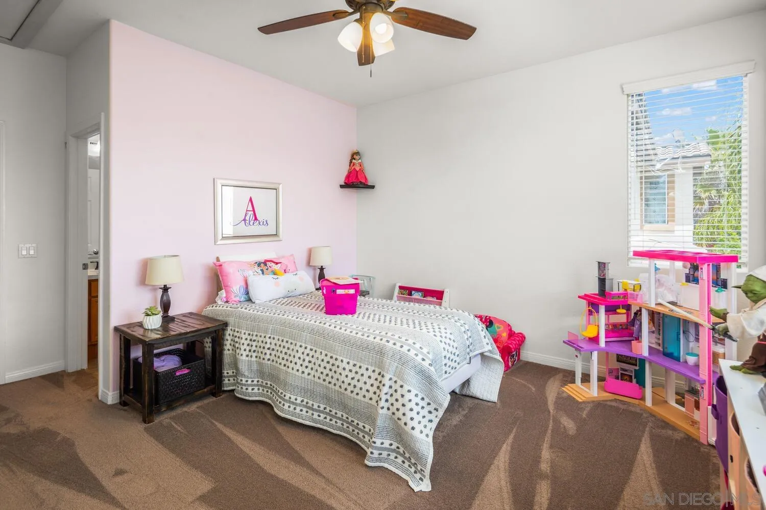 16327 Pinto Ridge Drive 4S Ranch, CA 92127 - Photo 50 of 74 a bedroom with a bed and a chandelier