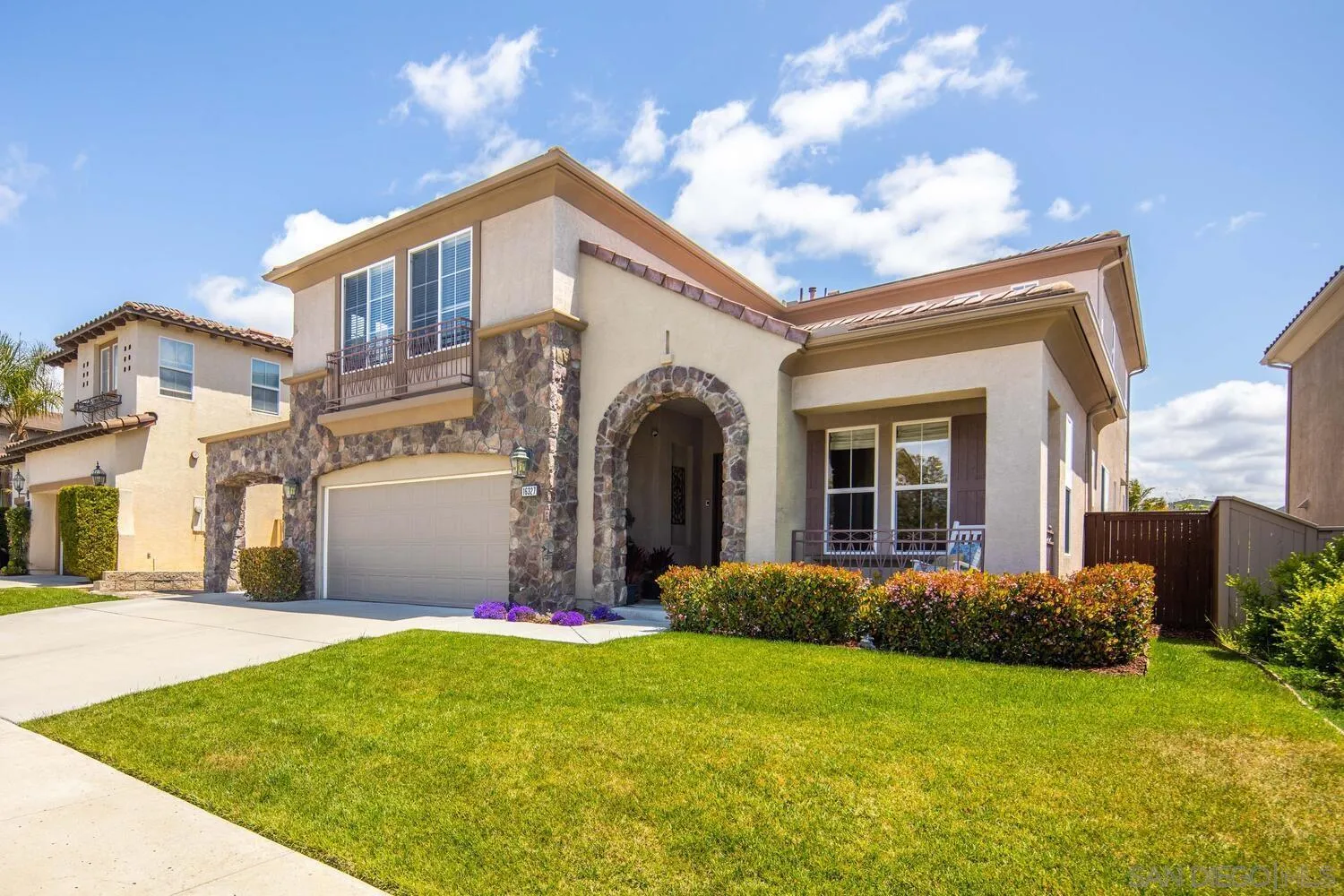16327 Pinto Ridge Drive 4S Ranch, CA 92127 - Photo 5 of 74 a front view of a house with a garden and plants