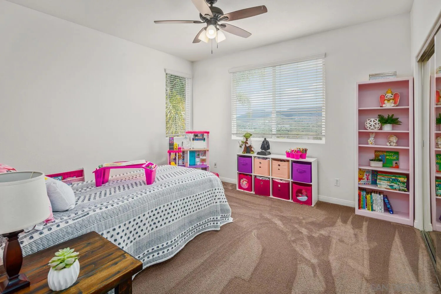 16327 Pinto Ridge Drive 4S Ranch, CA 92127 - Photo 51 of 74 a bedroom with a bed and a chandelier